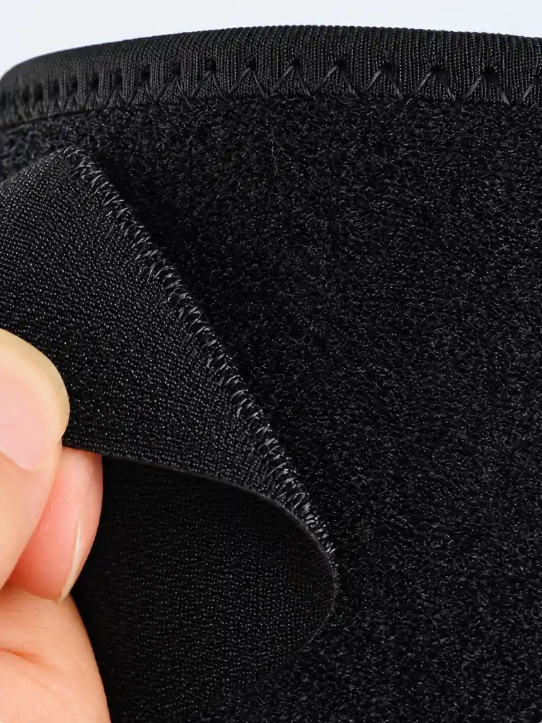 Close-up of adjustable hook-and-loop strap and closure detail