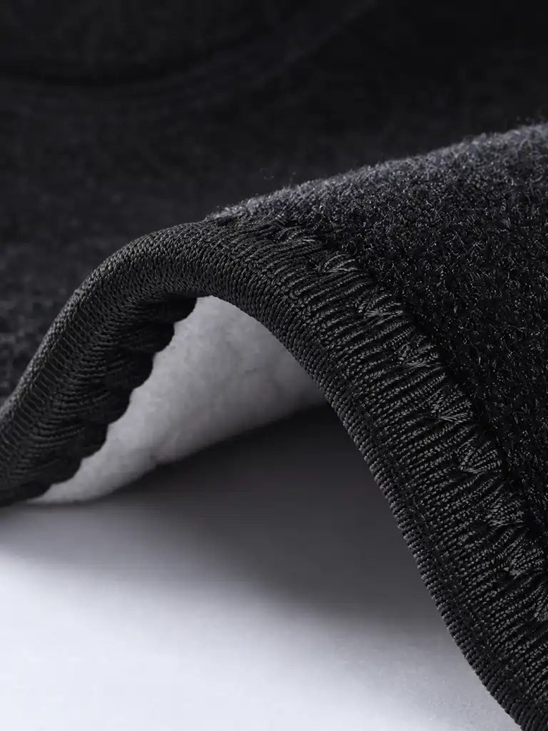 Macro view of smooth seam stitching and edge binding on a calf brace