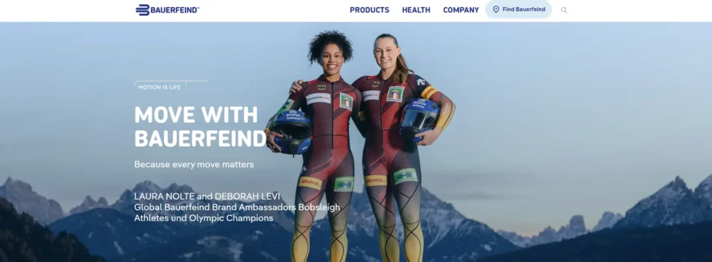 Bauerfeind website homepage showing two bobsleigh athletes in racing suits against a mountain background.